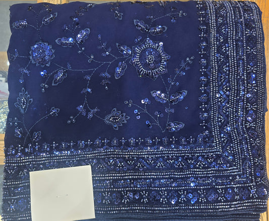 Navy saree with full work all over with matching full sleeve blouse.