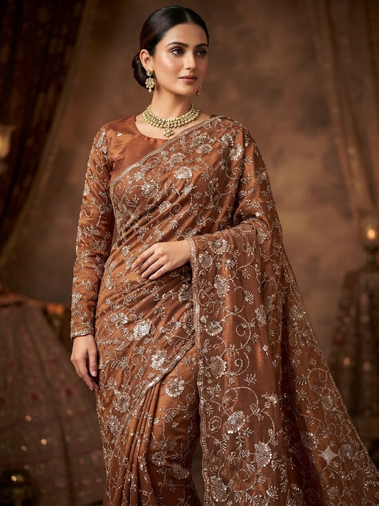 Golden brown saree on soft satin organza fabric with all over work. Comes with full sleeve blouse.