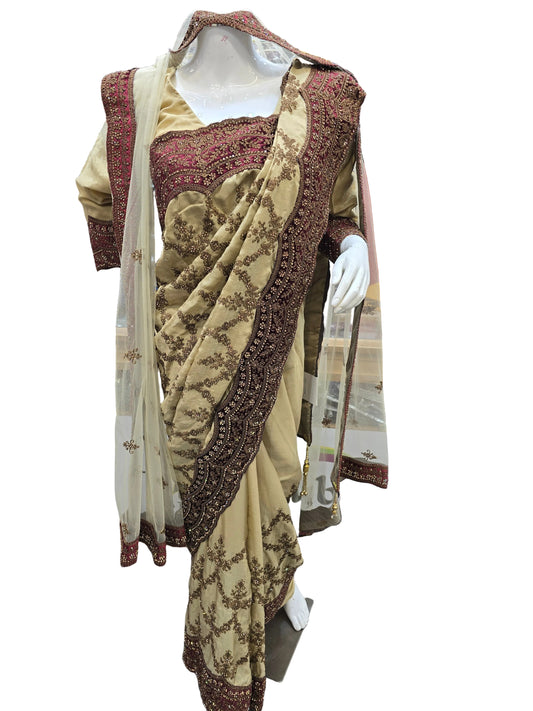Heavy satin gold bridal saree with dupatta.