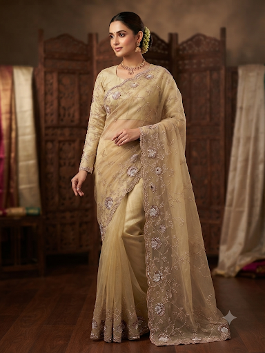 Gold soft organza gold saree with ready made full sleeve blouse.